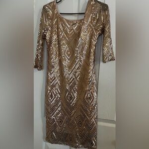 Rose gold sequin dress.